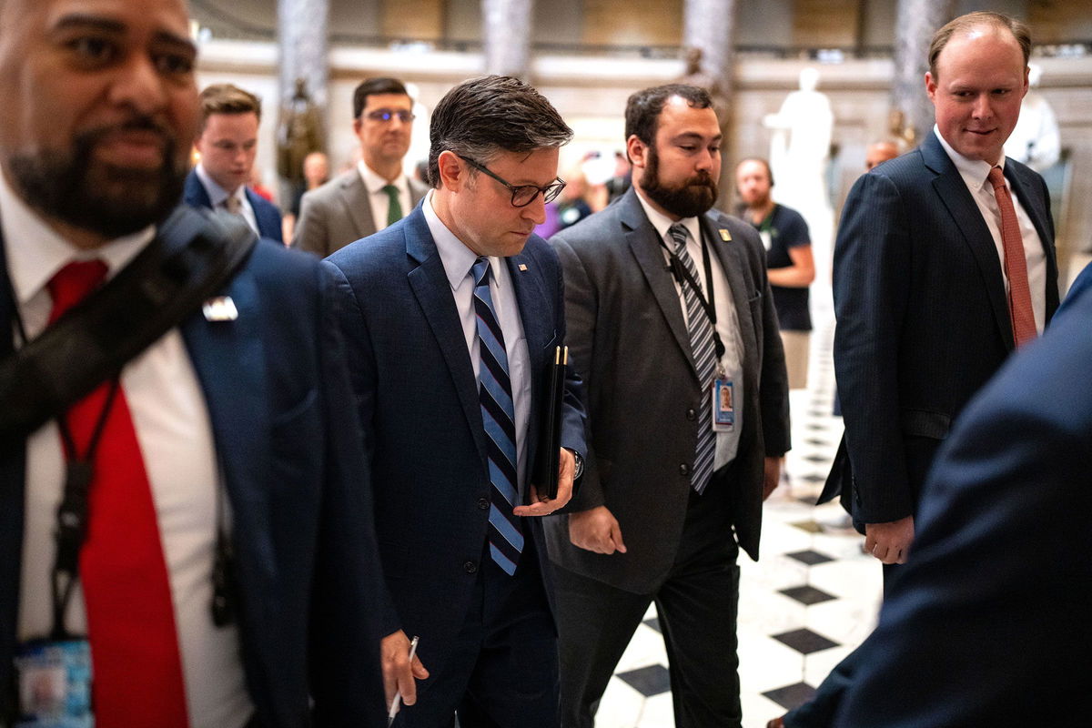 <i>Kent Nishimura/Getty Images via CNN Newsource</i><br/>House Speaker Mike Johnson walks from his office to the house floor at the US Capitol on September 12 in Washington