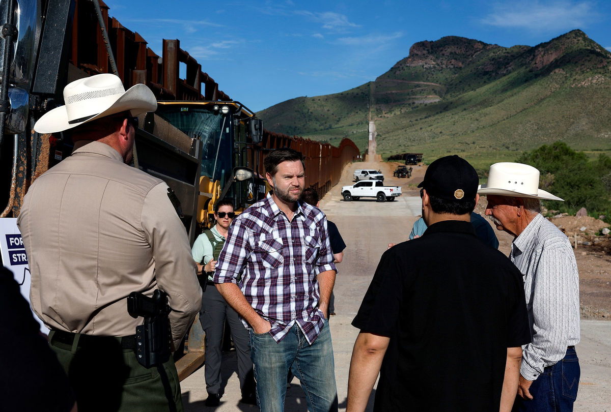 <i>Anna Moneymaker/Getty Images via CNN Newsource</i><br/>Sen. JD Vance talks with Sheriff Robert Watkins of Cochise County