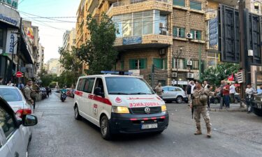 An ambulance rushes wounded people to a hospital in Beirut on September 17