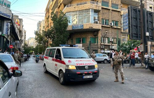 An ambulance rushes wounded people to a hospital in Beirut on September 17