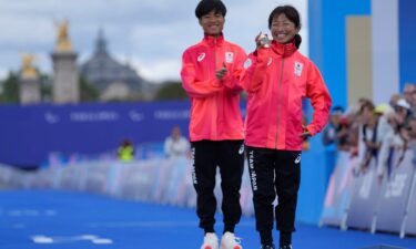 Japan's Misato Michishita poses with her bronze medal after the race.