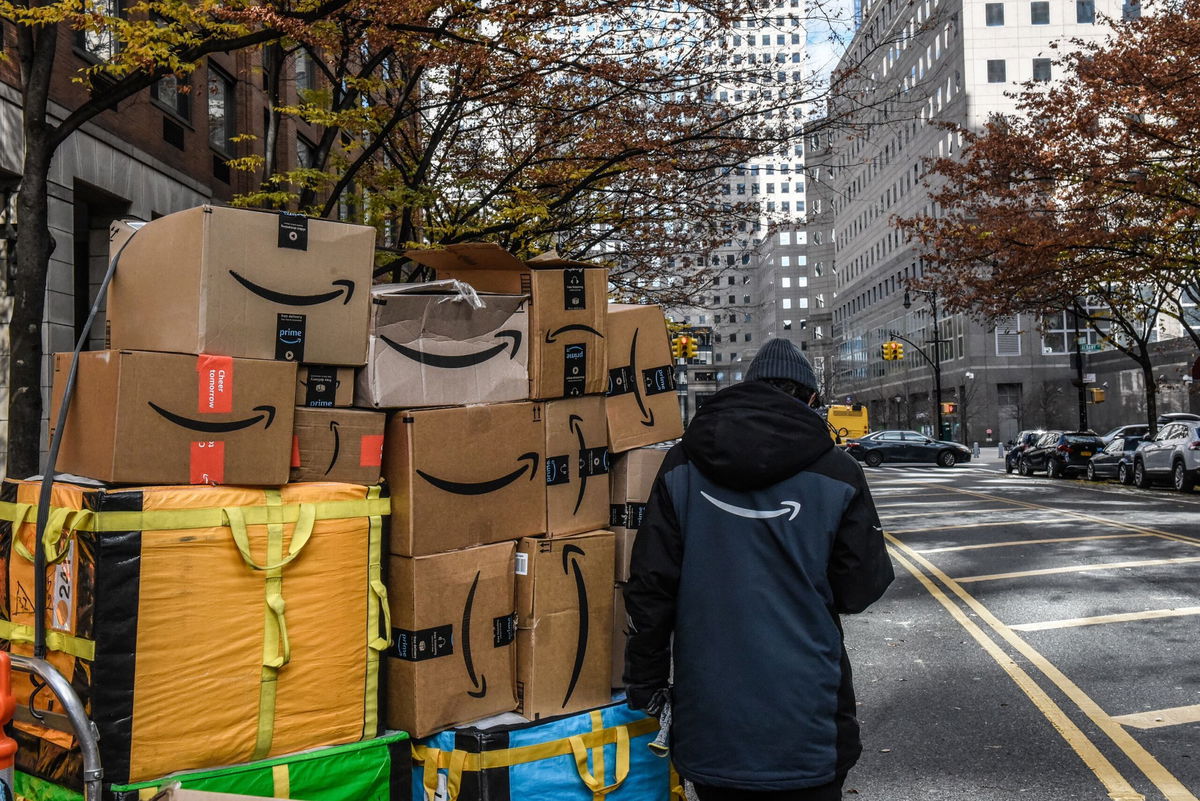 <i>Stephanie Keith/Bloomberg/Getty Images via CNN Newsource</i><br/>An Amazon worker delivers packages on Cyber Monday in New York on Monday