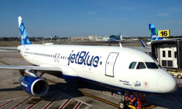 A JetBlue Airways plane is serviced at a gate at John F. Kennedy International Airport in a file photo.