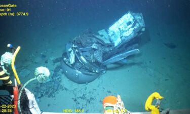 A video still frame shows the remains of the Titan submersible