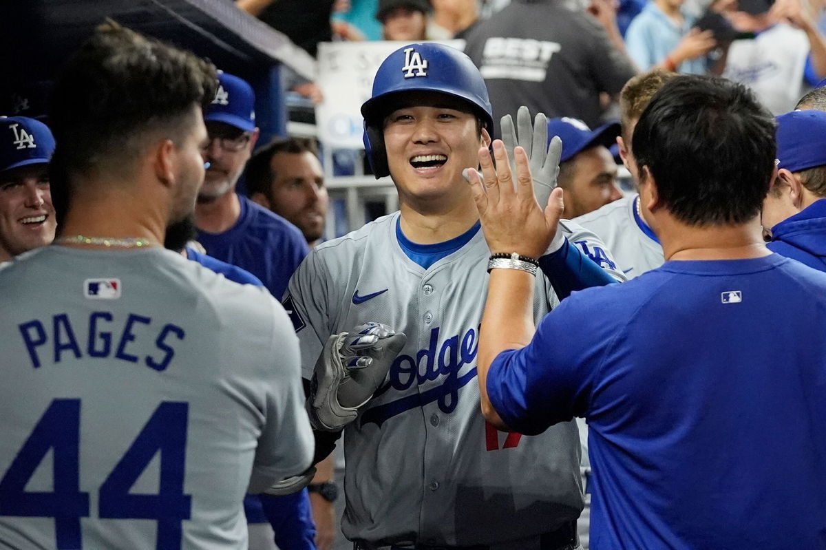 <i>Marta Lavandier/AP via CNN Newsource</i><br/>Los Angeles Dodgers' Shohei Ohtani celebrates after hitting his 50th home run of the season during the seventh inning of a baseball game against the Miami Marlins