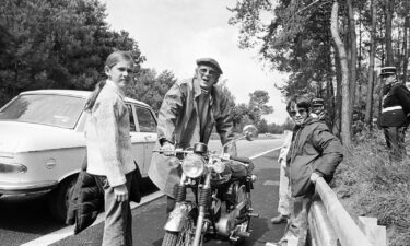 Actor Steve McQueen relaxes with his daughter Terry and his son Chad as he stars in the movie "Le Mans" in Le Mans