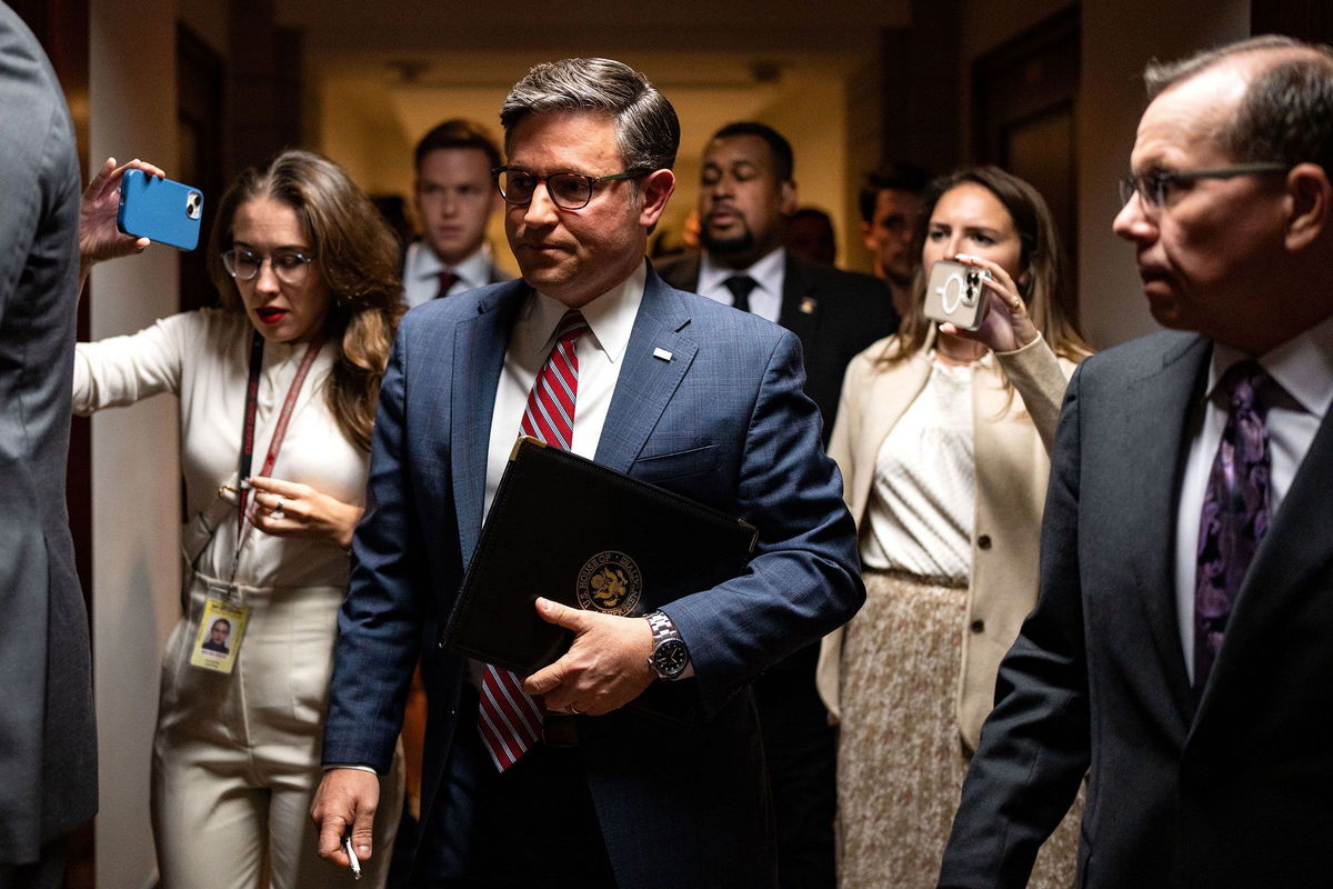 <i>Kent Nishimura/Getty Images via CNN Newsource</i><br/>House Speaker Mike Johnson speaks with reporters as he departs a news conference at the US Capitol in Washington