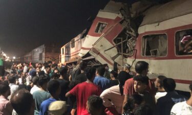 People surround two passenger trains which collided in the Egyptian city of Zagazig on September 14.