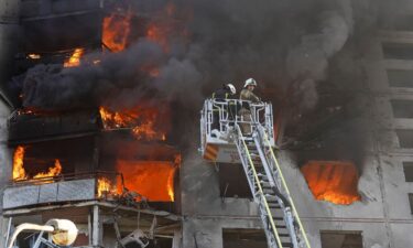 Firefighters tackle a blaze after a Russian aerial bomb struck a multi-story residential building in Kharkiv