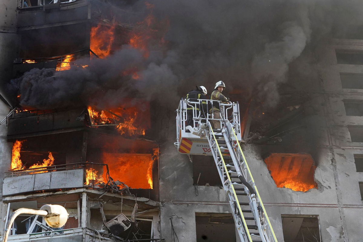 <i>Andrii Marienko/AP via CNN Newsource</i><br/>Firefighters tackle a blaze after a Russian aerial bomb struck a multi-story residential building in Kharkiv