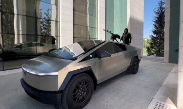 Leader of Russia's Chechnya region Ramzan Kadyrov and what is said to be a Tesla Cybertruck equipped with a machine gun in Grozny