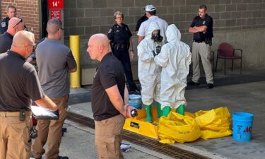 A hazmat crew from the National Guard's Civilian Support Team investigates after a suspicious package was delivered to election officials at the Missouri Secretary of State's Jefferson City