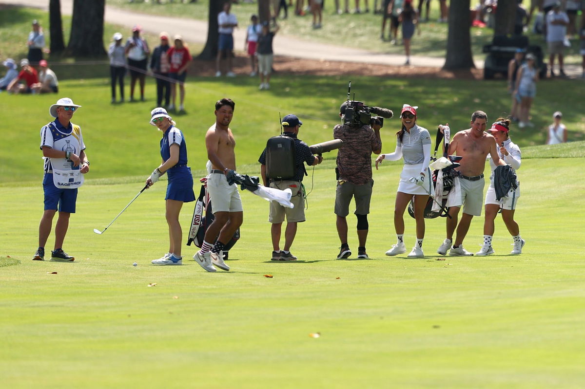 <i>Scott Taetsch/Getty Images via CNN Newsource</i><br/>The caddies react to Lee's long-range hole out.