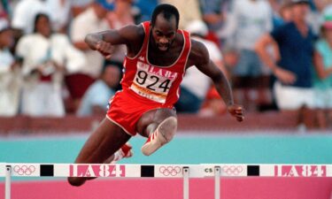 US' Edwin Moses jumps over a hurdle on his way to winning the gold medal in the 400-meter hurdles at the Summer Olympic Games in Los Angeles