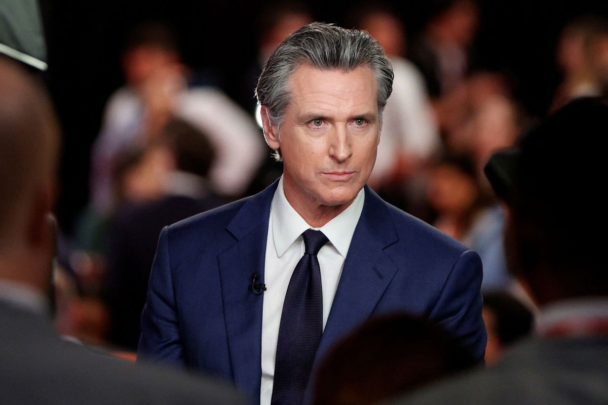 <i>Marco Bello/Reuters via CNN Newsource</i><br/>California Gov. Gavin Newsom speaks to reporters after the CNN presidential debate in Atlanta on June 27.