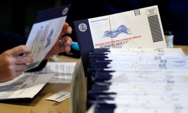 Election workers process mail-in and absentee ballots in West Chester