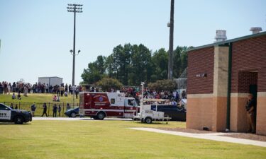 Students wait to be picked up by their parents after a shooting at Apalachee High School on September 4 in Winder