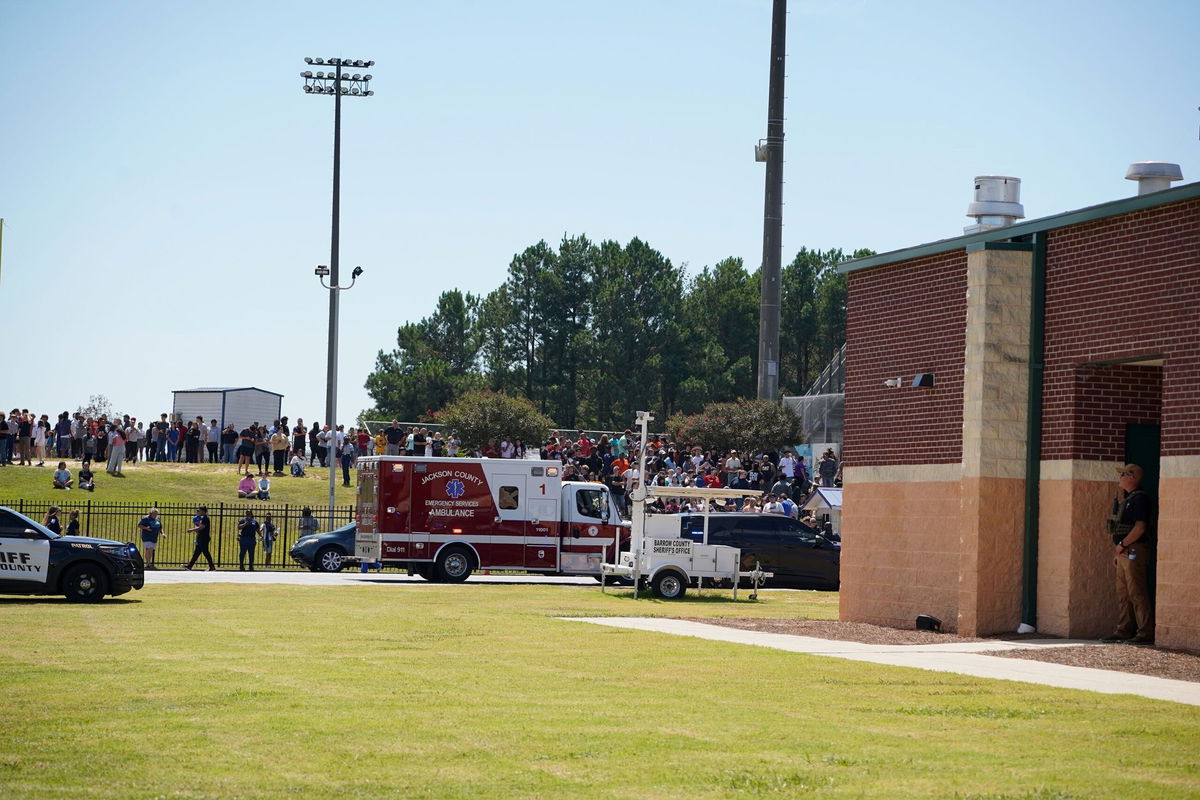 <i>Megan Varner/Getty Images via CNN Newsource</i><br/>Students wait to be picked up by their parents after a shooting at Apalachee High School on September 4 in Winder