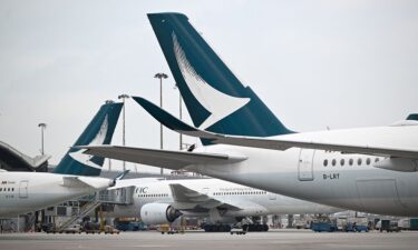 Hong Kong-based airline Cathay Pacific has banned two passengers from its flights after an argument over seat-reclining etiquette descended into xenophobic insults.