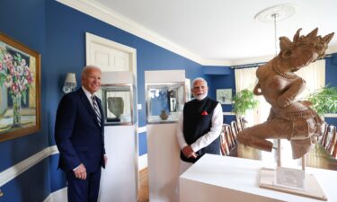 US President Joe Biden and Indian Prime Minister Narendra Modi pose in front of several artifacts that will be returned to India on September 21.