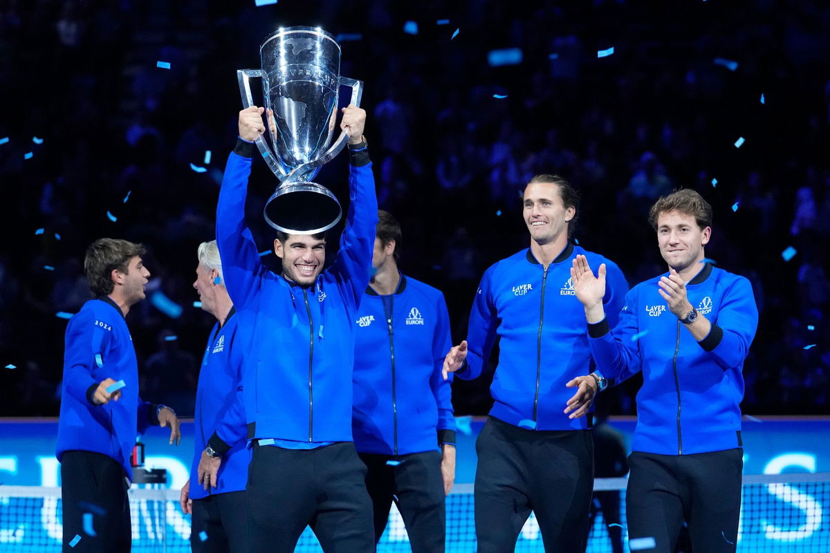 <i>Ebrahim Noroozi/AP via CNN Newsource</i><br/>Carlos Alcaraz lifts the Laver Cup after Europe's victory.