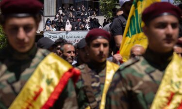 Women attend the funeral of Hezbollah fighters Abbas Ahmad Srour and Mohammad Hussein Kassem in Aita al Chaab