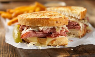 A Reuben sandwich is pictured.