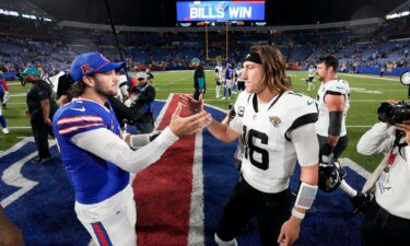 Bills quarterback Allen (left) shakes hands with Jaguars quarterback Lawrence (right) after Buffalo's victory.