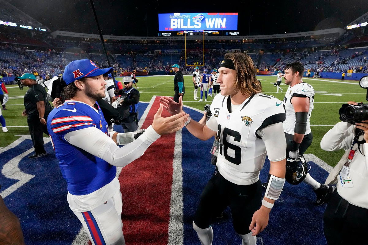 <i>Steven Senne/AP via CNN Newsource</i><br/>Bills quarterback Allen (left) shakes hands with Jaguars quarterback Lawrence (right) after Buffalo's victory.