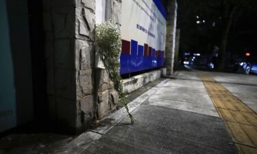 While flowers are placed at the location where the boy was fatally stabbed.