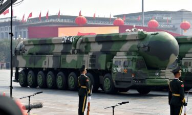 Military vehicles carrying DF-41 intercontinental ballistic missiles roll during a parade to celebrate the 70th anniversary of the founding of the People's Republic of China on October 1