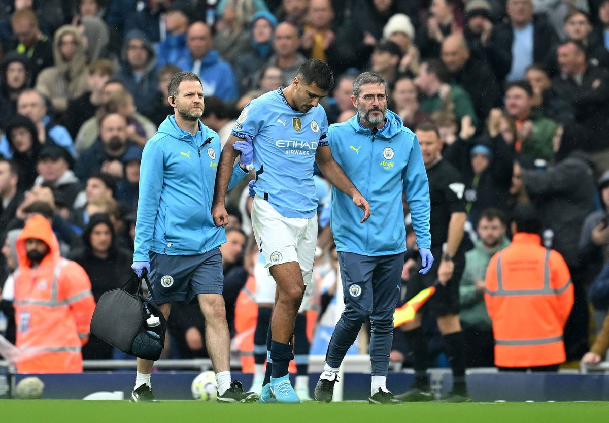 <i>Michael Regan/Getty Images via CNN Newsource</i><br/>Rodri limps off the pitch following the injury in the 21st minute.