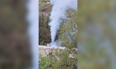 A leaking train car spews an unknown chemical into the air