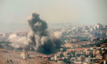 Smoke rises from Israeli airstrikes in the village of Kfar Rouman