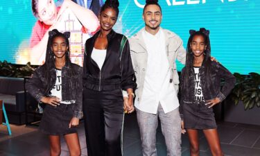 Kim Porter (second from left)