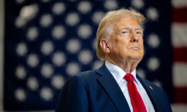 Republican presidential nominee former US President Donald Trump pauses before speaking during a campaign rally at the Mosack Group warehouse on September 25 in Mint Hill