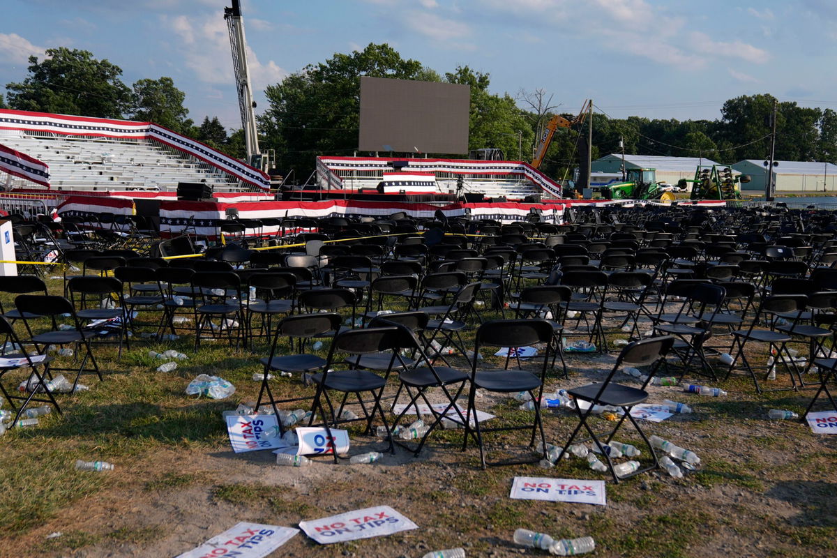 <i>Evan Vucci/AP via CNN Newsource</i><br/>A campaign rally site for Republican presidential candidate former President Donald Trump is empty and littered with debris July 13 in Butler