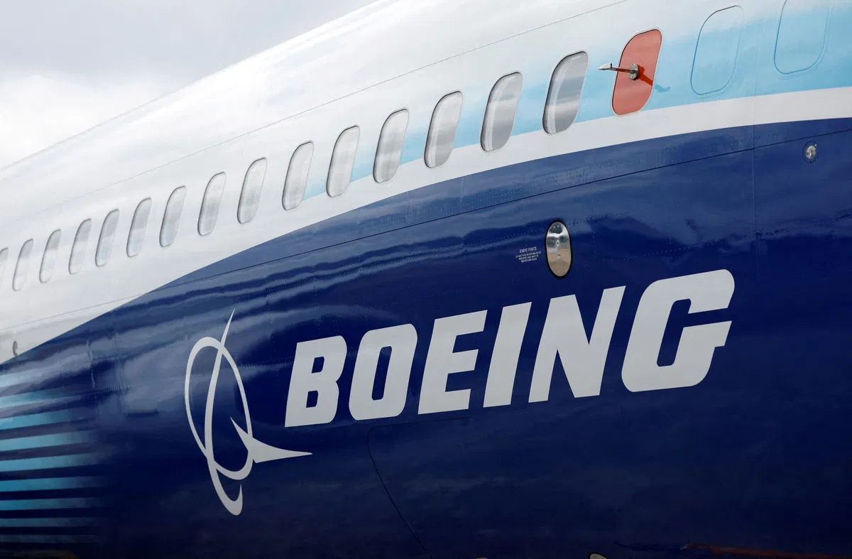 <i>Peter Cziborra/Reuters via CNN Newsource</i><br/>The Boeing logo is seen on the side of a Boeing 737 MAX at the Farnborough International Airshow