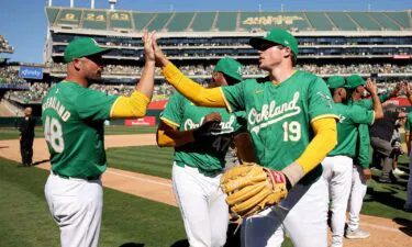 Athletics reliever Mason Miller (No. 19) and teammates celebrate the final home win in Oakland.