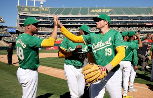 Athletics reliever Mason Miller (No. 19) and teammates celebrate the final home win in Oakland.