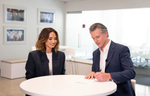 Demi Lovato joins California Gov. Gavin Newsom to sign legislation to protect the financial security of child influencers.