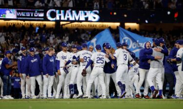 LA celebrates after defeating the San Diego Padres 7-2 to win the NL West at Dodger Stadium.