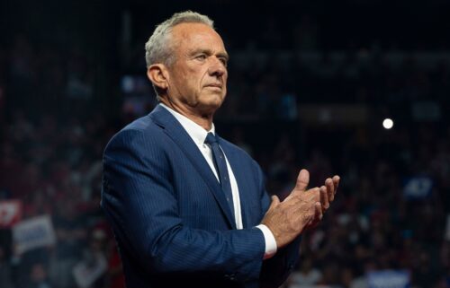 Former Republican presidential candidate Robert F. Kennedy Jr. listens during a campaign rally for Republican presidential nominee