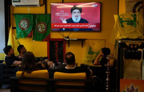 People sit in a cafe in Beirut to watch a speech by Nasrallah on September 19. It came after Israel detonated explosions across Lebanon targeting Hezbollah fighters. Many of those killed were civilians.