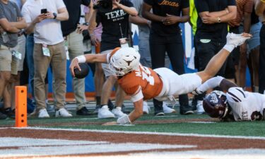 Texas quarterback Arch Manning dives toward the goalline during the second half.