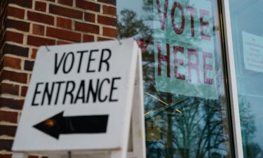 Signs directing voters are seen ouside a polling place on March 5 in Mountain Brook