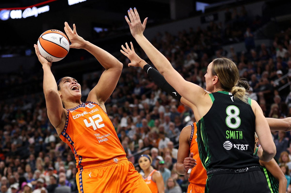 <i>Matt Krohn/USA TODAY Sports/Reuters via CNN Newsource</i><br/>Connecticut Sun forward Brionna Jones shoots over Minnesota Lynx forward Alanna Smith.