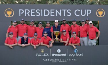 Team USA poses with the trophy after winning the 2024 Presidents Cup at Royal Montreal Golf Club in Quebec