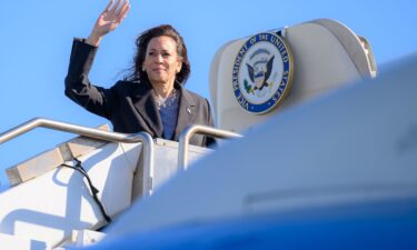 US Vice President and Democratic presidential candidate Kamala Harris waves as she boards Air Force Two departing San Francisco International Airport in San Francisco