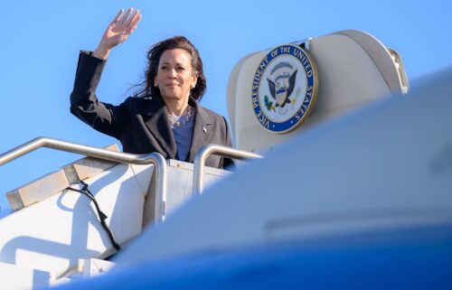 US Vice President and Democratic presidential candidate Kamala Harris waves as she boards Air Force Two departing San Francisco International Airport in San Francisco